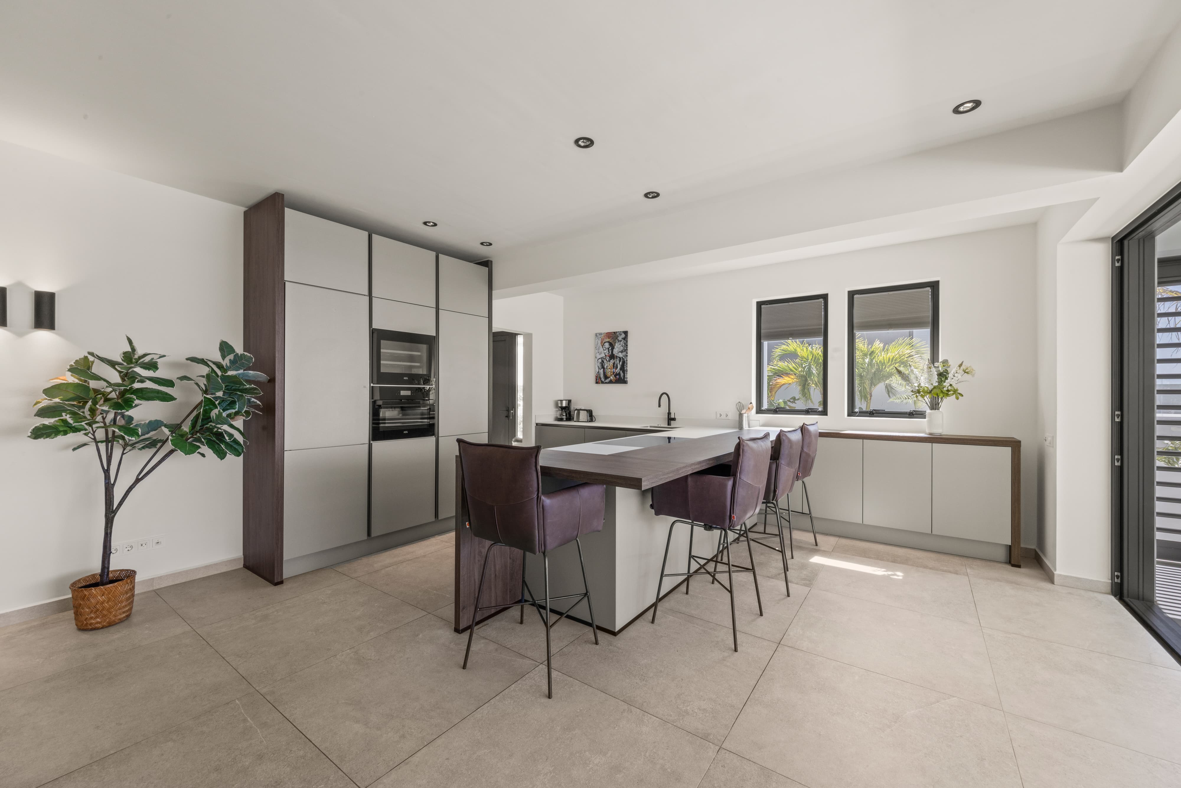 kitchen with bar and barstoods